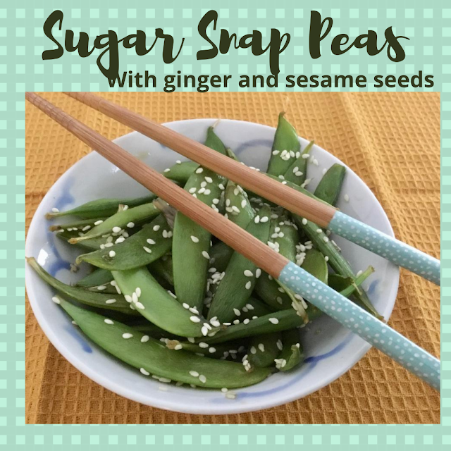 sugar snap peas in a bowl covered in sesame seeds