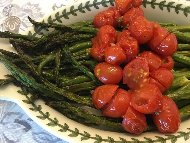 asparagus on a plate roasted asparagus on a fancy plate with roasted tomatoes