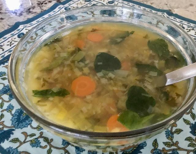 Leek, chickpea, and spinach noodle soup