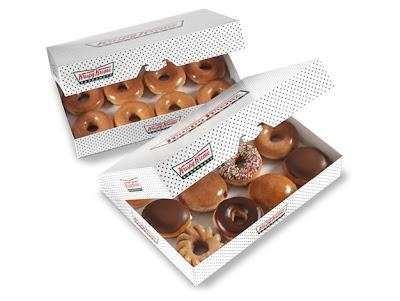 A dozen Krispy Kreme Original Glazed donuts next to an assorted dozen donuts.