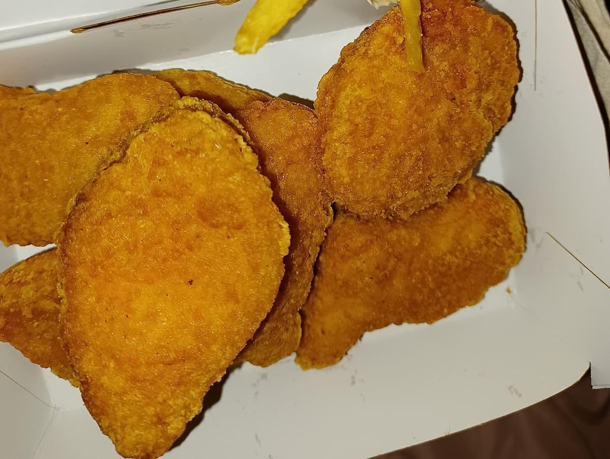 McDonalds McNuggets in a box with fries and ketchup