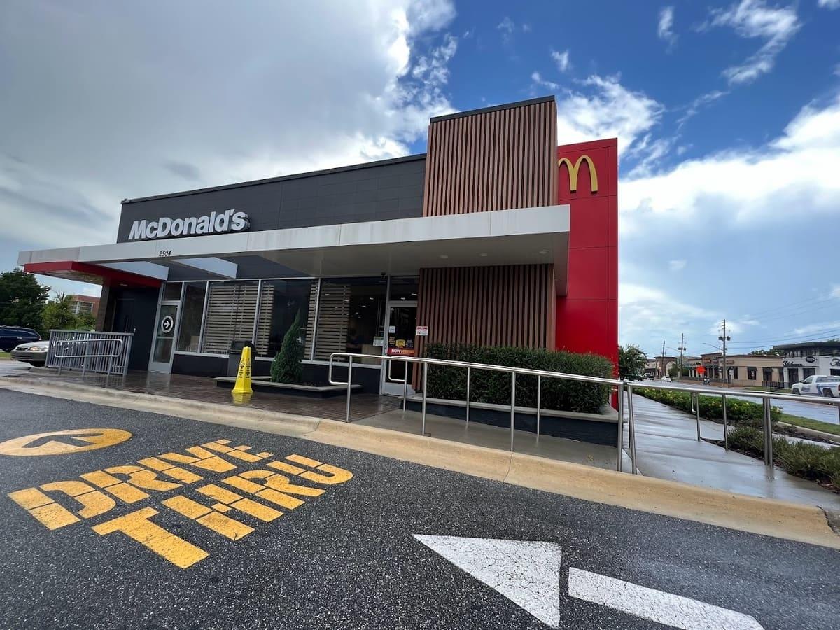 A mcdonald's restaurant with a drive thru sign.