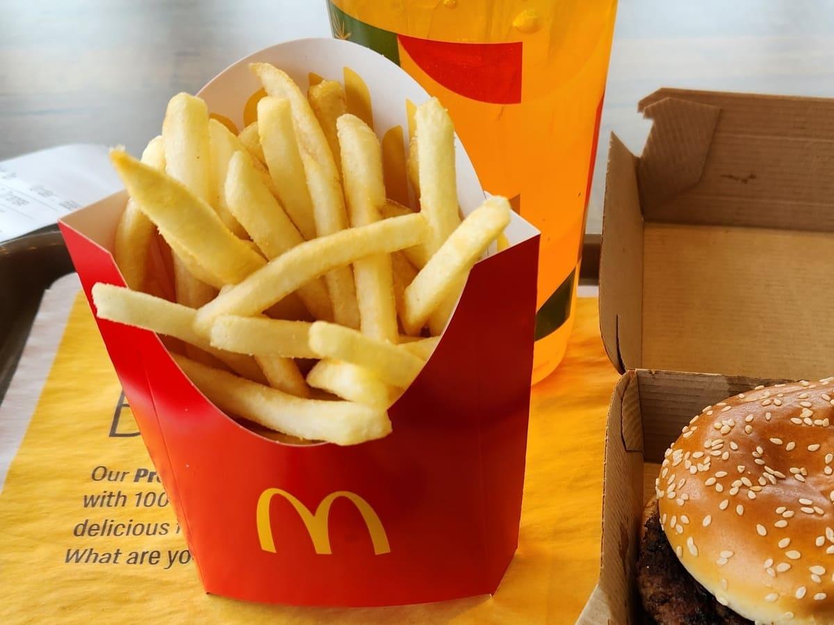 Mcdonald's french fries and a mcdonald's drink.