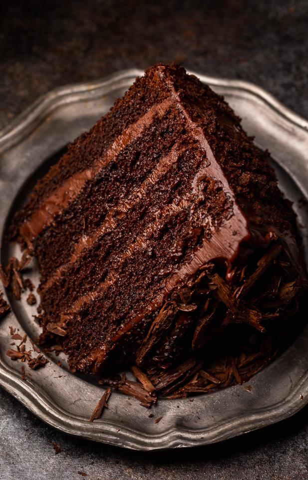 If you love chocolate cake, you have to try this sinfully delicious recipe for Devil's Food Cake! It's an old-fashioned recipe that's intensely rich, moist yet dense, and totally decadent! Exploding with rich chocolate flavor and covered in chocolate frosting, it's sure to become your favorite chocolate cake recipe!