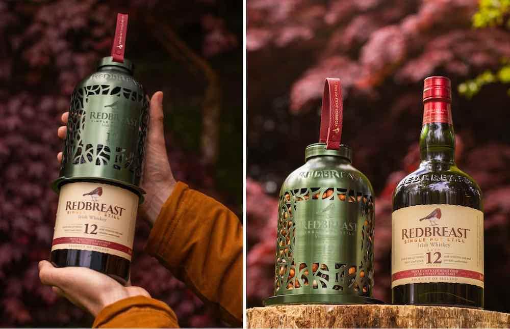 hands holding the Redbreast bird feeder bottle