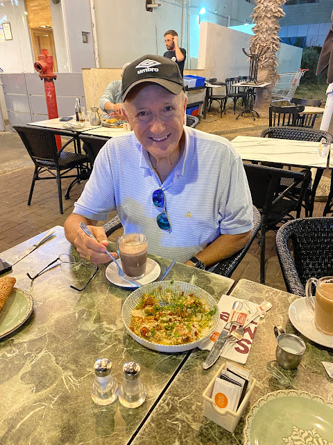 man drinking coffee, Israel, hummus