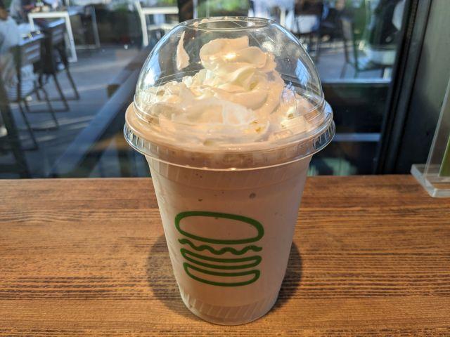 Side-view of Shake Shack's Coffee & Donuts Shake.