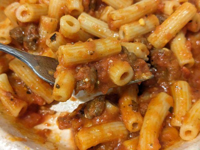 Marie Callendar's Rigatoni Bolognese Bowl close-up with fork.