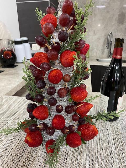 Christmas tree made of fruit, strawberries, grapes