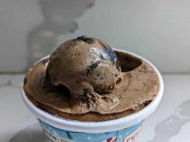 Side-view of a scoop of McConnell's Peppermint Mocha and Brownie Bites Dairy-Free "Ice Cream."