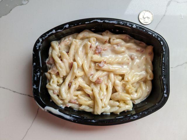 Top-down view of Devour White Cheddar Mac & Cheese with Bacon.