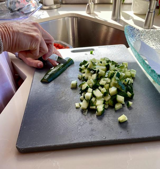 chopped cucumbers on cutting board