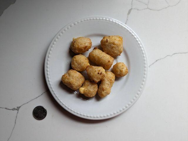 Trader Joe's Breaded Cheddar Cheese Curds on a plate.