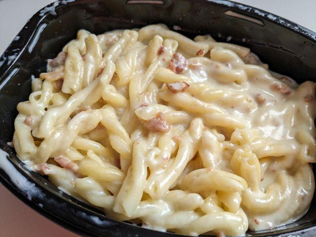 Close-up of Devour White Cheddar Mac & Cheese with Bacon.