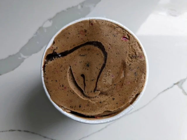 Top-down view of an open container of McConnell's Peppermint Mocha and Brownie Bites Dairy-Free "Ice Cream."