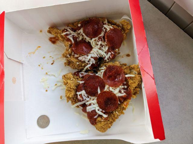 KFC's Chizza in a box next to a quarter.