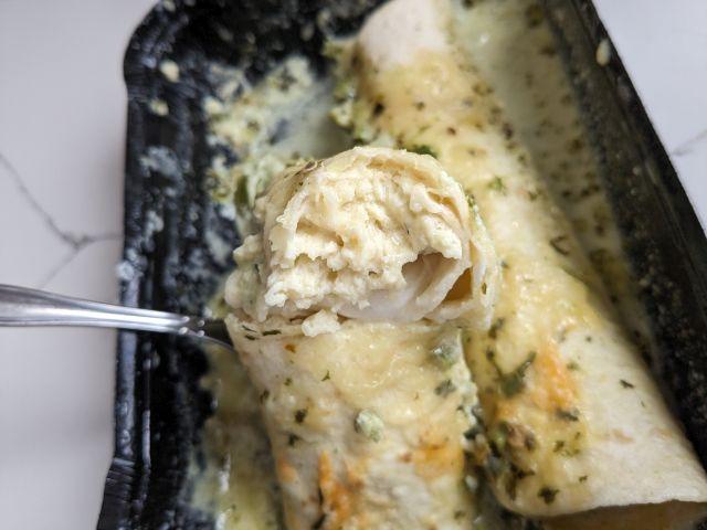 Cross-section of Real Good Foods Creamy Poblano Chicken Enchilada.