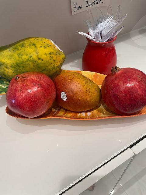 tropical fruit in a bowl, papaya, mango, pomegranate