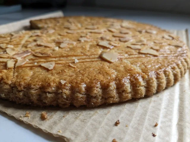 Close-up of the edge of a Trader Joe's Shortbread French Butter Cookie.