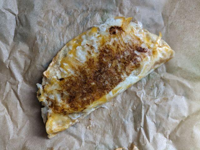 Taco Bell Grilled Cheese Dipping Taco with an even layer of grilled cheese.