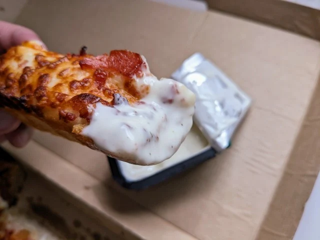 Pizza Hut Bacon Cheddar Cheese Stick dipped in ranch.