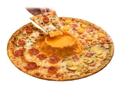 Pizza being dipped in Domino's Cheese Volcano Pizza.