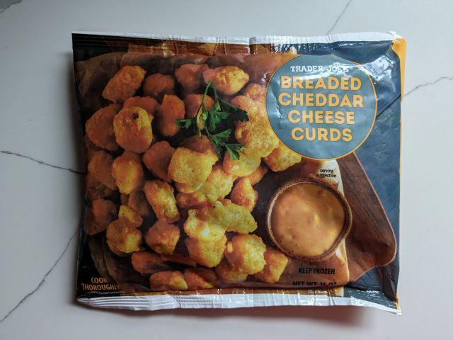 A bag of Trader Joe's Breaded Cheddar Cheese Curds.