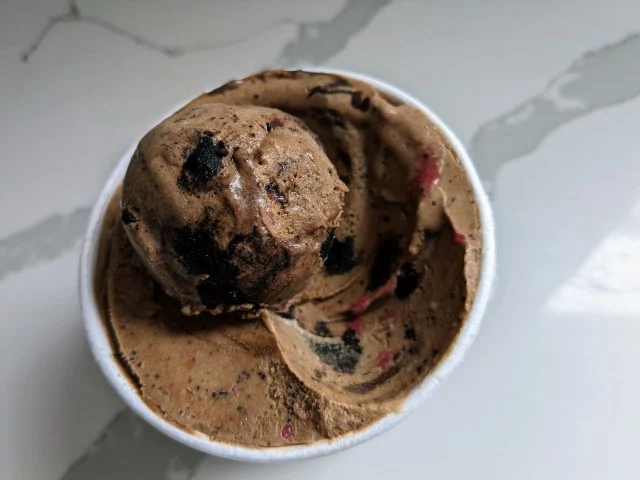 Top-down view of a scoop of McConnell's Peppermint Mocha and Brownie Bites Dairy-Free "Ice Cream."