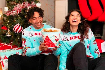 KFC holiday collection sweaters and bucket.