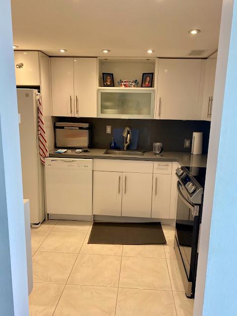 small kitchen with stove and sink