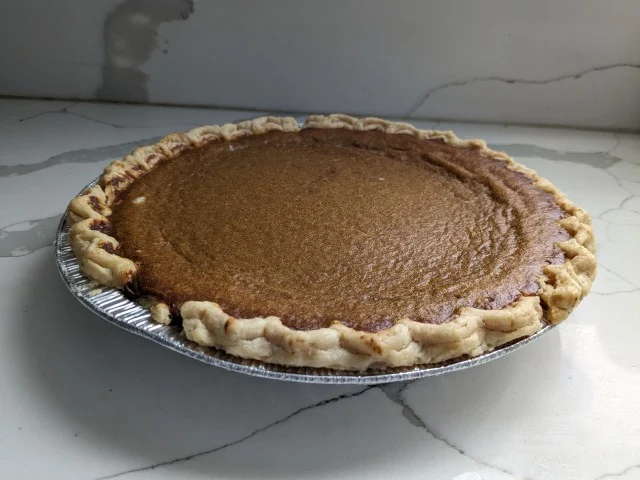 Side-view of a baked Village PieMaker Pumpkin Pie.