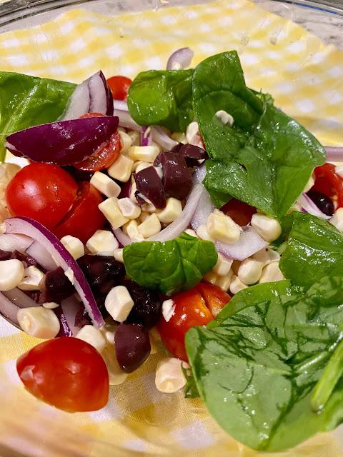 salad vegetables with corn, olives, tomatoes