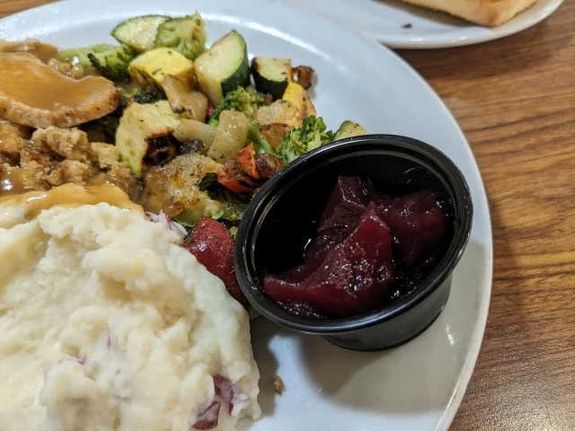 Close-up of Denny's veggies and cranberry sauce.