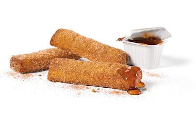 Jack in the Box's Churro French Toast Sticks with syrup for dipping.