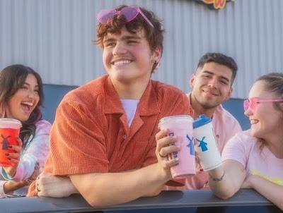 A group of friends with holding various Dutch Luv beverages.