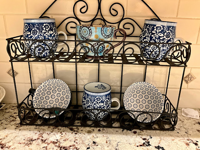 pottery on a counter in a case