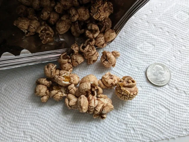 Smartfood Marshmallow Hot Cocoa Popcorn next to a quarter.