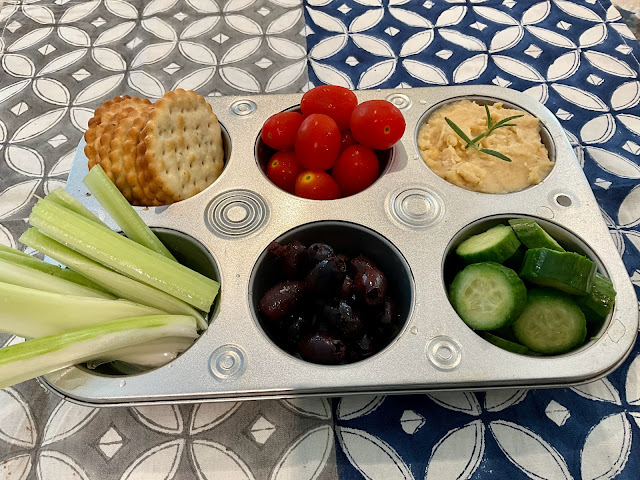 muffin tin filled with snacks