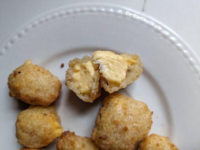 Cross-section of Trader Joe's Breaded Cheddar Cheese Curds.