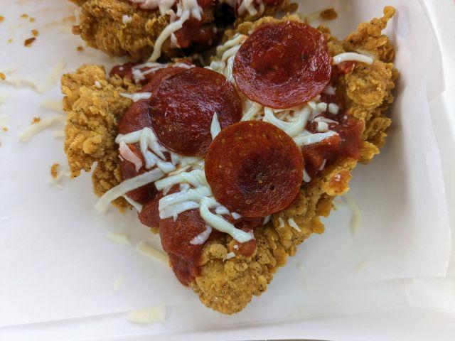 A top-down close-up of KFC's Chizza.