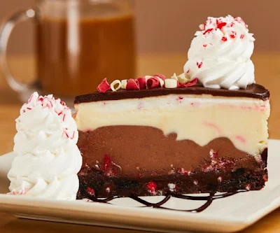 A slice of The Cheesecake Factory's Peppermint Stick Chocolate Swirl Cheesecake.