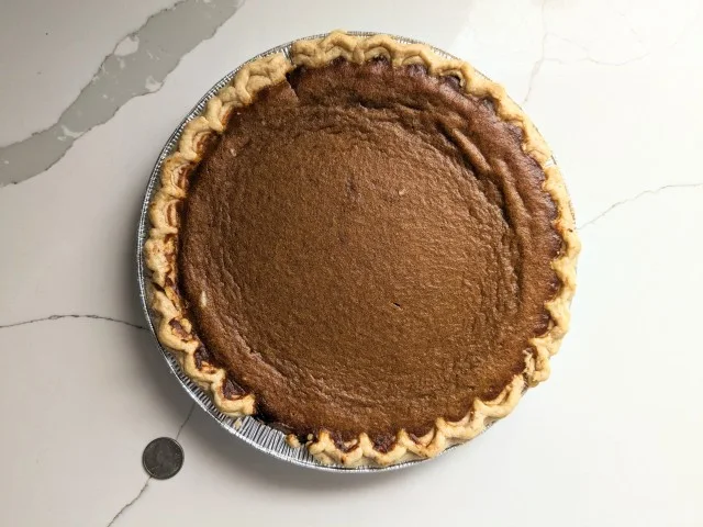 Top-down view of a baked Village PieMaker Pumpkin Pie.