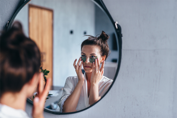 woman using skin care for eye bags | Stress Red Dots on Skin