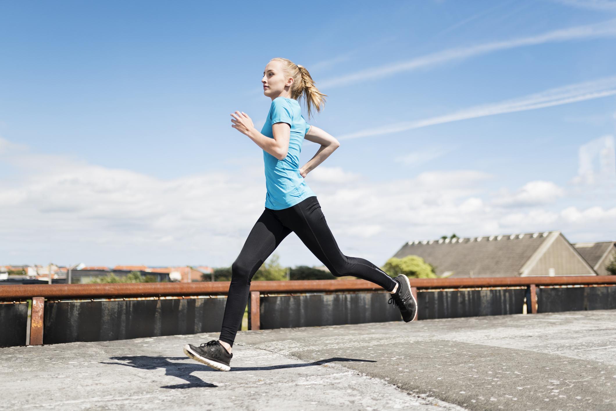 Woman Displays Good Running Form Outside | Butt Kicks