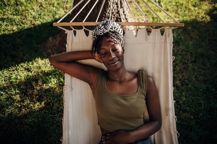 Woman Naps on Hammock | Sleep Hygiene