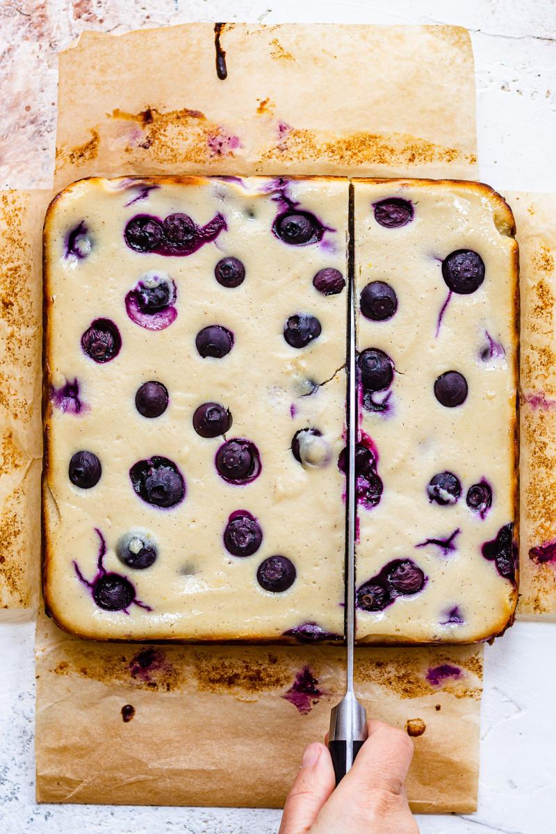 vegan cheesecake bars blueberries cutting