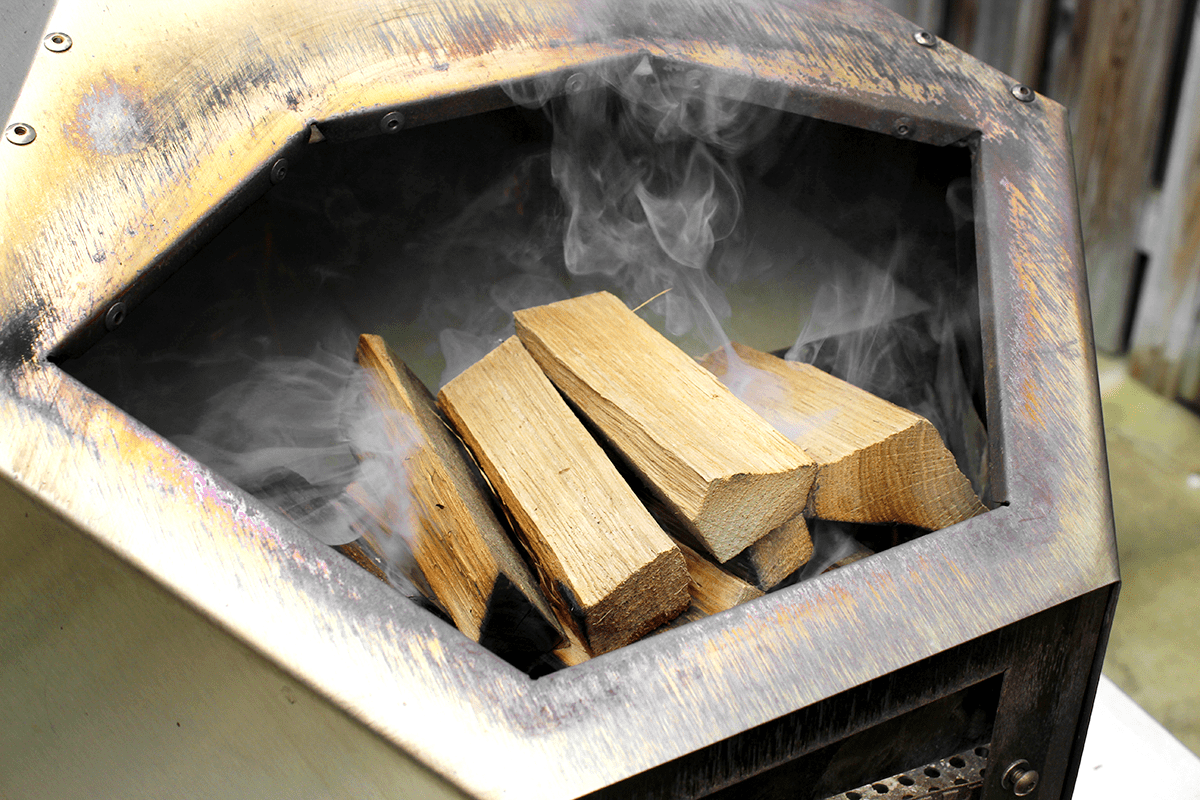 lighting the wood in the pizza oven