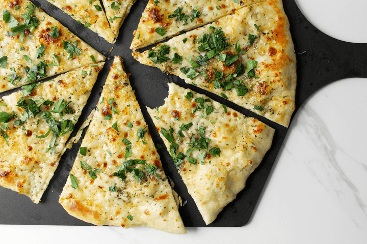 White pizza, cut with parsley