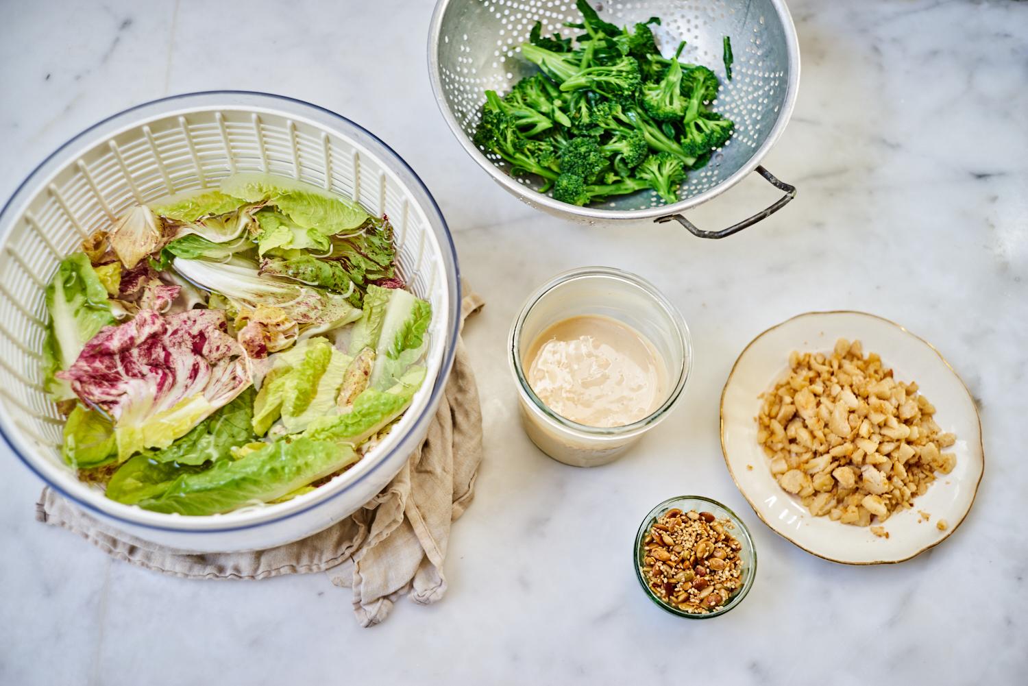 Anna Jones california salad with beans, miso, avocado in big ceramic salad bowl