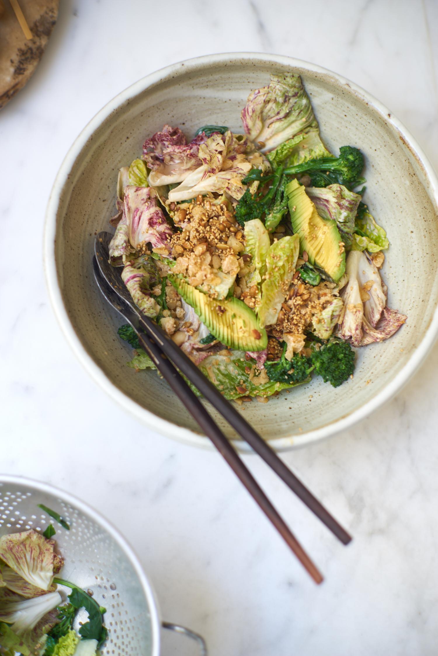 Anna Jones california salad with beans, miso, avocado in big ceramic salad bowl